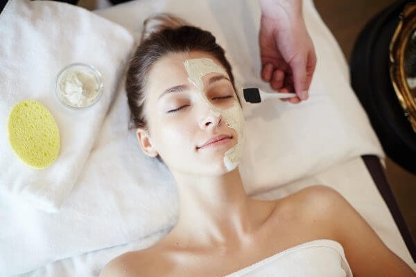 Woman Enjoying Skincare In Spa